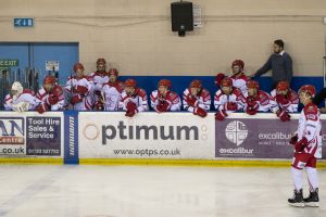 Wildcats in front of Optimum board